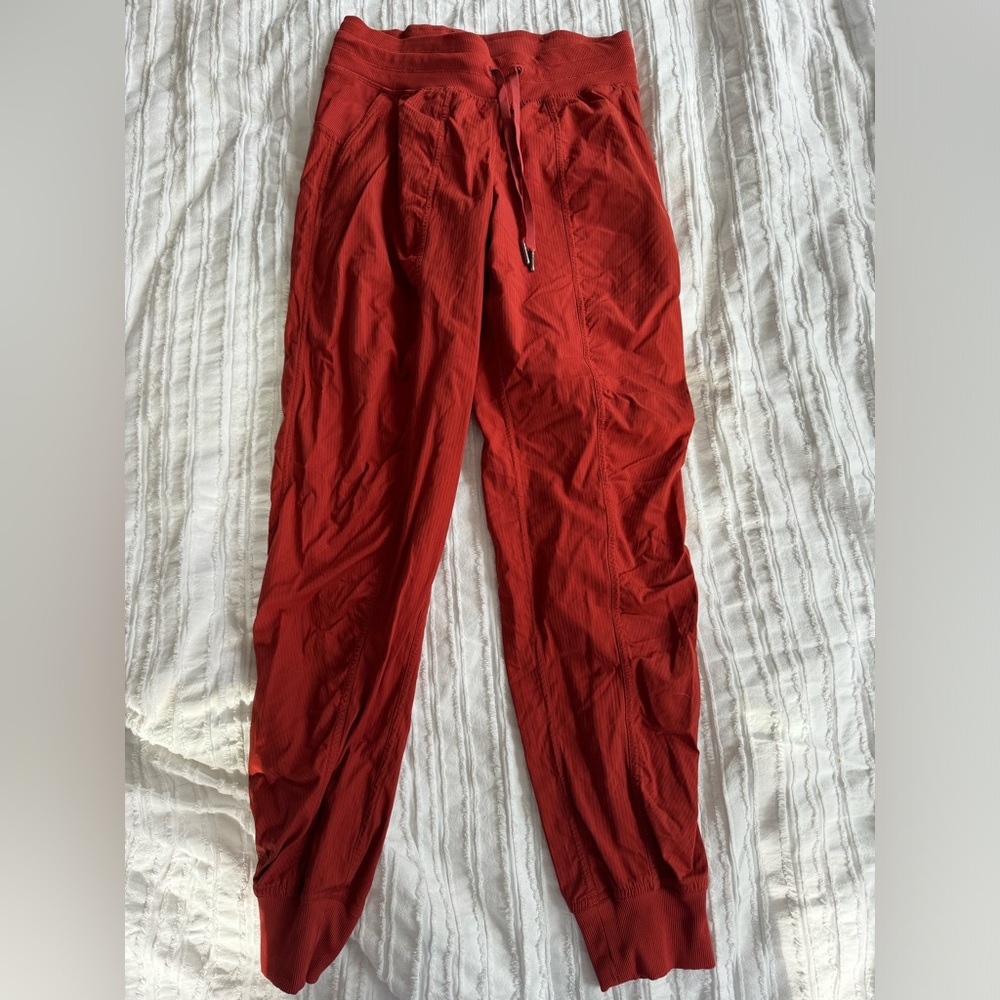Burnt orange colored lululemon dance studio joggers